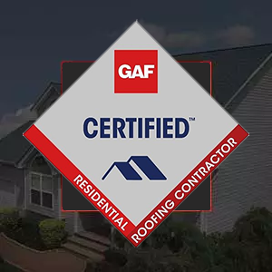 Gray asphalt roofing shingles on house with blue siding